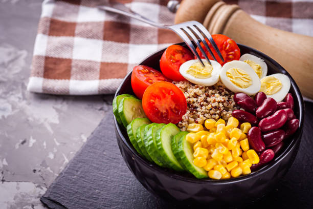 istock bowl of healthy quinoa with vegetables on a dark rustic background 1295504908
