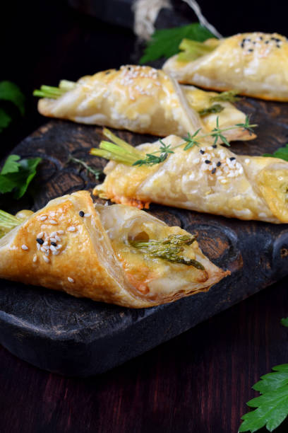 istock Green asparagus and cheese puff pastry 1295510787