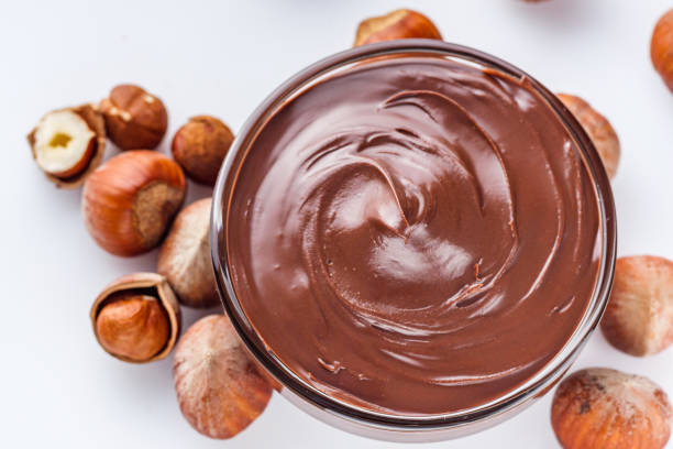 istock chocolate butter and hazelnuts on a white acrylic background 1295512009