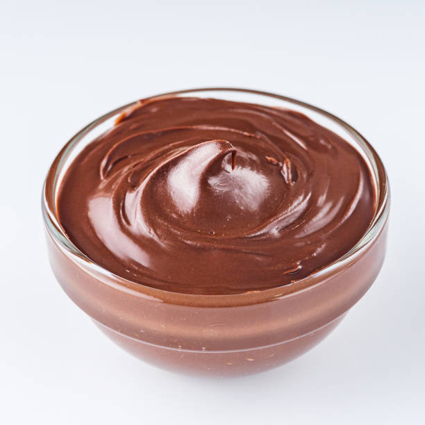 istock chocolate butter and hazelnuts on a white acrylic background 1295512018