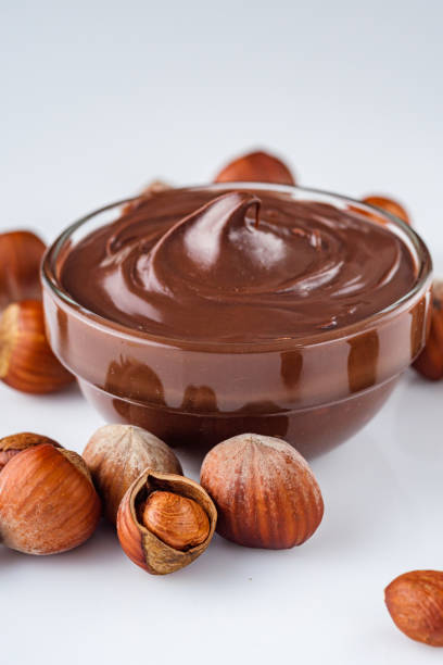 istock chocolate butter and hazelnuts on a white acrylic background 1295512032