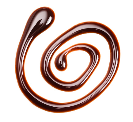 A Swirl of Chocolate Sauce Isolated on a White Background