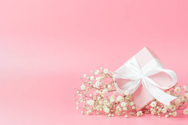 istock Gift box on pink background. There is room for text. 1295514231