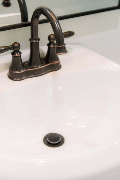 istock Sink and Faucet in New Home 1295514297