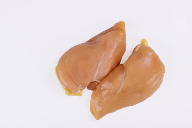 istock Raw chicken fillet isolated on white background. 1295515288