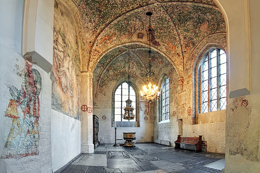 Malmo, Sweden - December 13, 2015: Interior of Tradesmen's Chapel (Kraemarekapellet) at St. Peter's Church (Sankt Petri kyrka). The construction of the church was started in 1313. The chapel was constructed after 1442 and contains a great wealth of frescoes from the late Middle Ages.