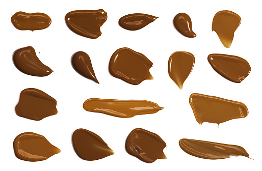 Swatches of Cocoa Toned Liquid Foundation Isolated on a White Background