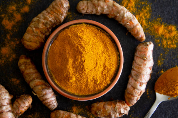 istock Turmeric root and powder. Close up. 1295519565