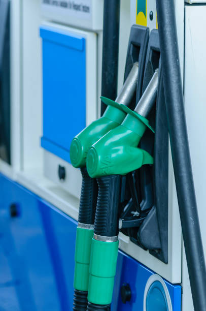 istock Nozzles on a petrol pump 1295520499