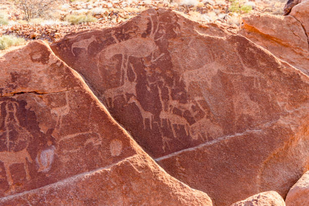 istock Stone age rock carvings at Twyelfontein, Namibia 1295520758