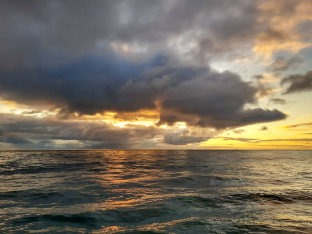 istock Reflections of sunset with cloudscape in lake water 1295520854