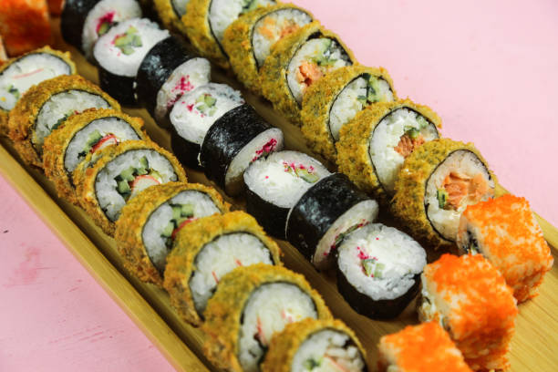 istock Various kinds of sushi served, close-up view 1295522421