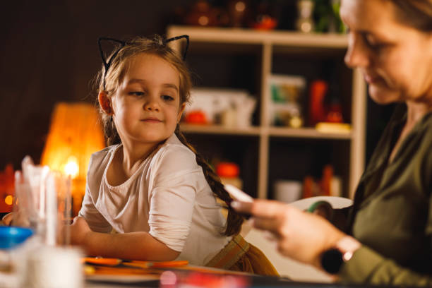 istock Assisting her mother in making fun crafts 1295527664