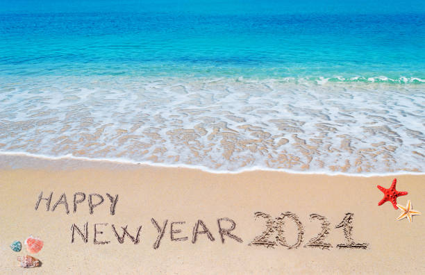 istock happy new year 2021 on the beach 1295528774