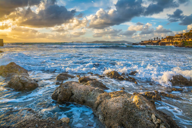 istock Dark clouds over Alghero rocky shore at sunset 1295528987