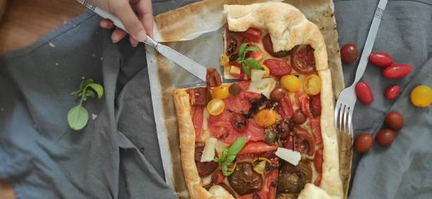 istock Homemade pizza with fresh tomatoes 1295530209