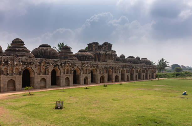 istock Long elephant stables at Zanana Enclosure, Hampi, Karnataka, India. 1295530590