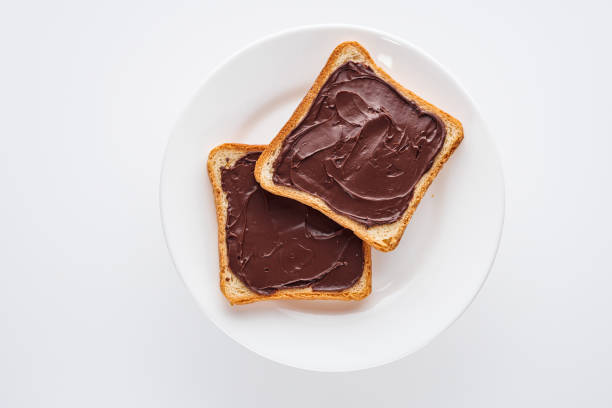 istock toasts with chocolate butter on a white acrylic background 1295530593