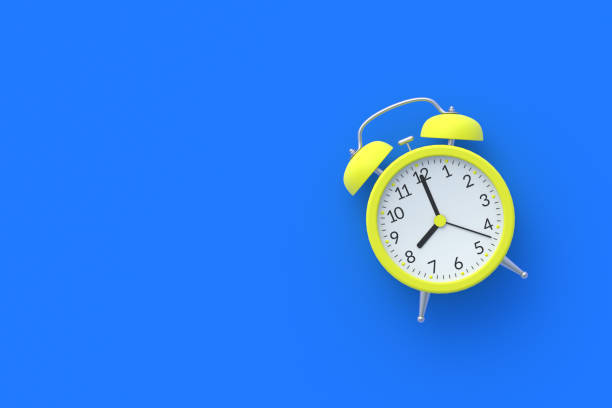 istock Single yellow vintage analog alarm clock on blue background. Wake-up concept. Punctuality. Countdown and deadline. Daily regime. Business planning. Top view. Copy space. 3d rendering 1295531601