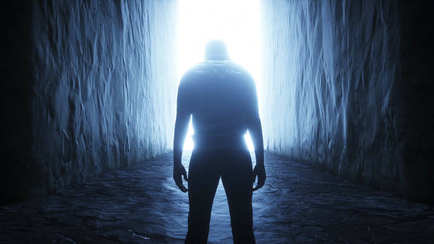 istock a lonely man stands in front of a light portal. 3d rendering. 1295532193