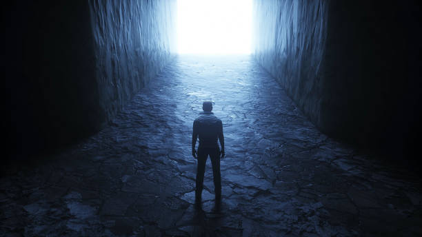 istock a lonely man stands in front of a light portal. 3d rendering. 1295532194