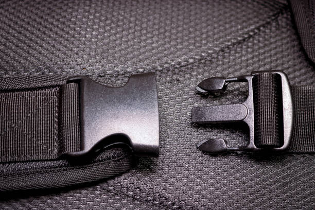 istock Black plastic buckle on the backpack. Plastic zip lock. Close-up. 1295541127