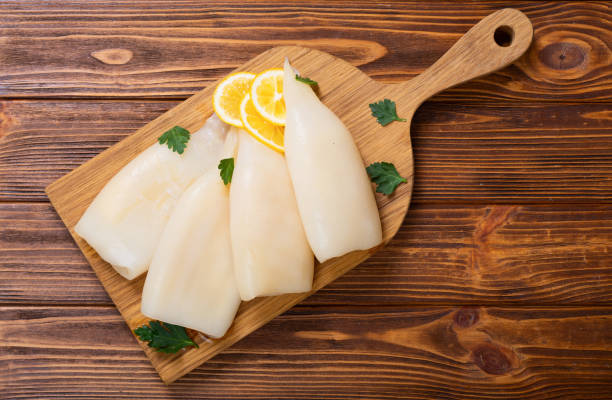istock Squid rings with lemon and rosemary 1295541380