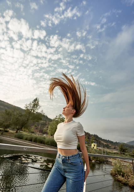 A beautiful woman poses for a photo where you can see the long blonde hair A beautiful woman poses for a photo where you can see the long blonde hair chilean wine stock pictures, royalty-free photos & images