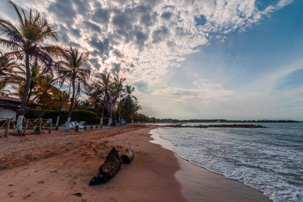 A beautiful sight of a tropical beach landscape, the sun is just rising in a wonderful and colorful sunrise