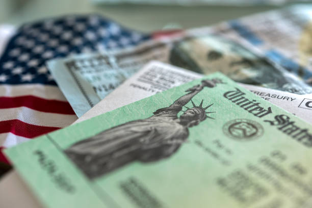 Stimulus check arrived Stimulus check: a check from the US government to ease the domestic economy during tough times of pandemics and economic crises. treasury stock pictures, royalty-free photos & images