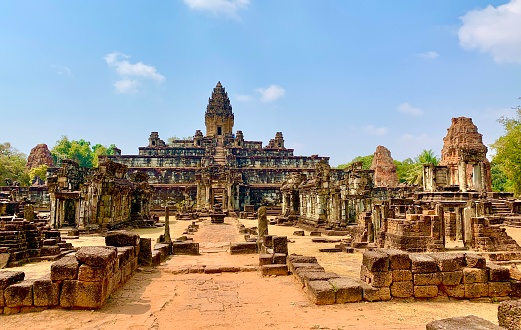 Roluos, Cambodia - January 23, 2020: Bakong Temple is the first temple-mountain constructed of sandstone by rulers of the Khmer empire in the final decades of the 9th century AD. It served as the official state temple of King Indravarman I in the ancient city of Hariharalaya, located in an area that today is called Roluos.