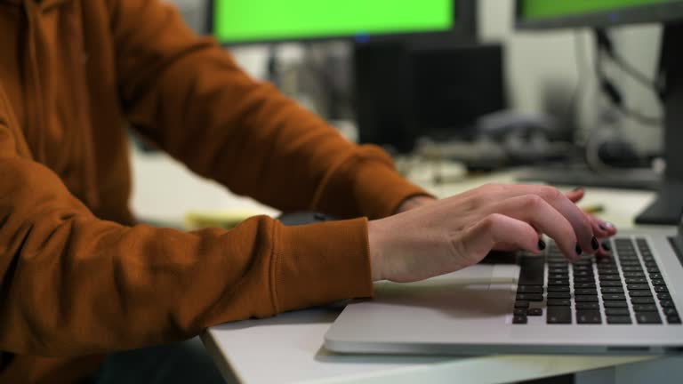 Hands of IT Business Professional Typing on Laptop Computer