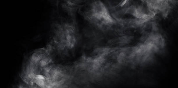 istock White smoke or mist in black background. 1295560371