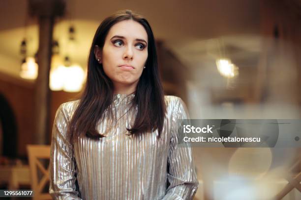 Bored Woman At A Party Thinking Of Something Else Stock Photo - Download Image Now - Embarrassment, One Woman Only, Party - Social Event