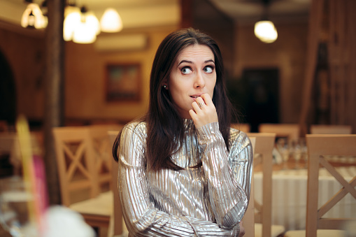 Woman feeling lonely at holiday celebratory event