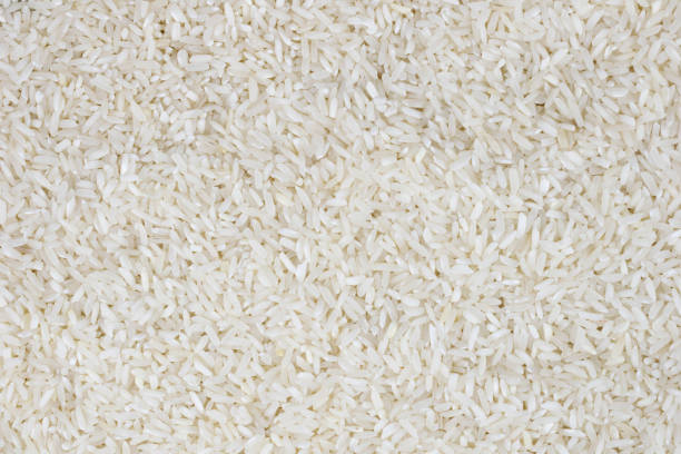 istock macro photo of white rice. background or texture 1295561818