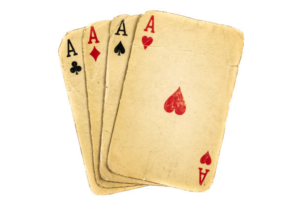istock Four old dirty aces poker cards on a white background 1295561875