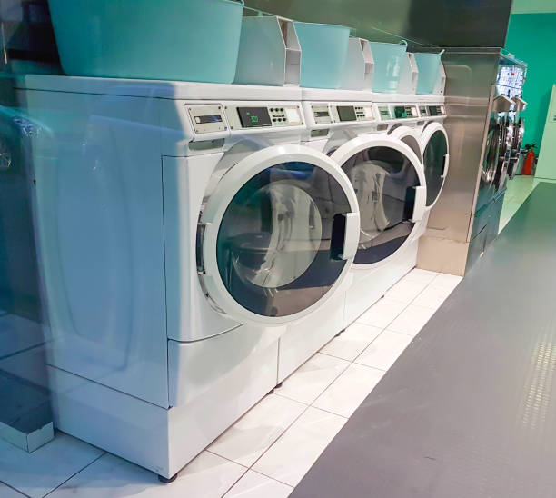 istock laundry shop wahs machines  empty open doors 1295565407