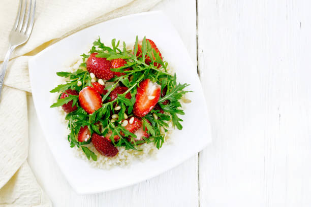 salad of strawberry and couscous on light board top - cedrine imagens e fotografias de stock