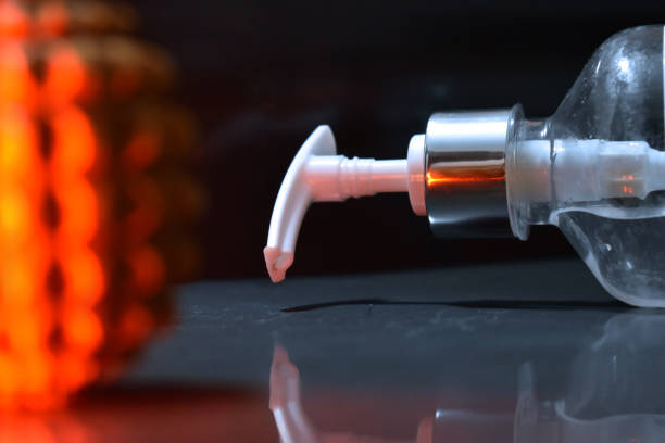istock Corona virus replica and Sanitizer bottle. 1295566720