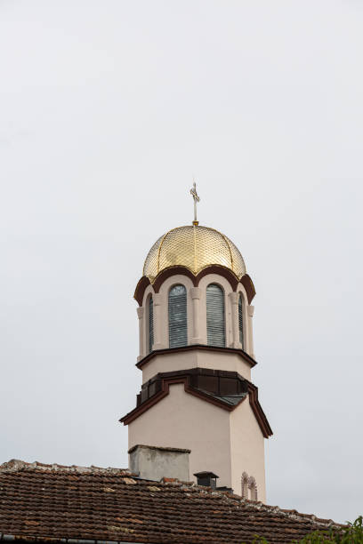 istock Church bell tower with golden cover 1295574510