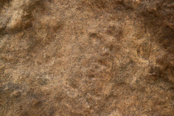 istock hard heavy rust copper granite stone surface of cave for interior wallpaper 1295574753