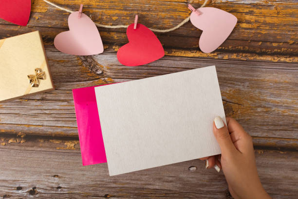 istock Female hand holding a blank card 1295575573