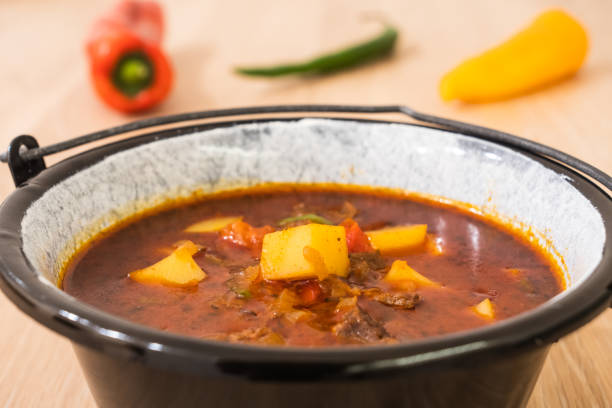 istock Hungarian Goulash or Gulyas Served in a Small Cauldron 1295576871