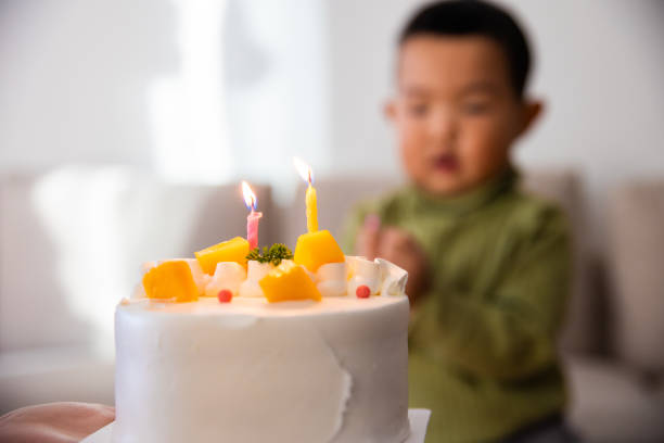 istock Child with a birthday cake 1295578829