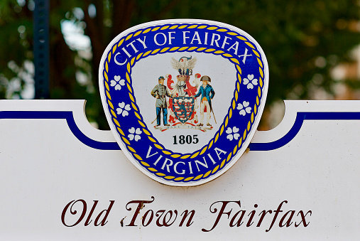 Fairfax, Virginia / USA - July 3, 2017: Close-up, City of Fairfax coat of arms on a sign in historic “Old Town Fairfax”.