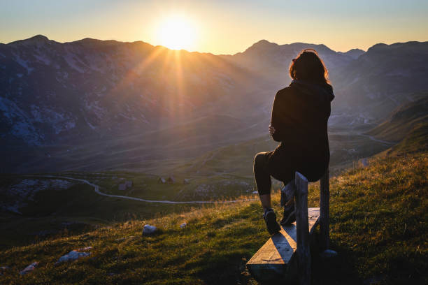 istock Woman in sunset 1295583466