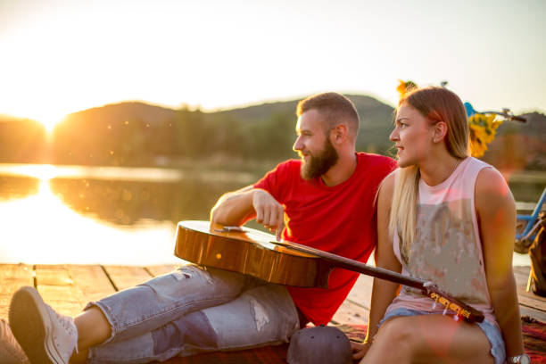 istock Enjoying a day playing guitar and relaxing outdoor 1295583568