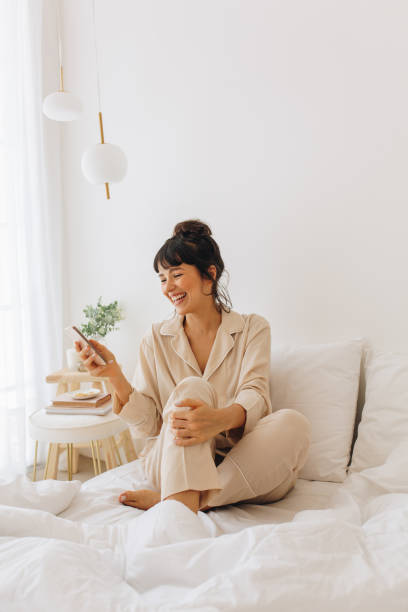 istock Woman doing video call on mobile phone 1295587669