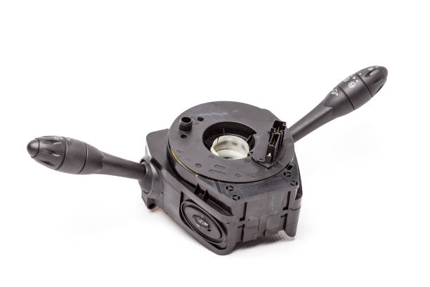 istock Steering wheel switches for windshield wipers and turn signals with steering angle sensor disassembled on a white isolated background, spare part for car repair or for sale at junk yard. 1295588399